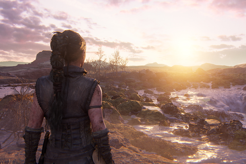 Imagem da cena do jogo Hellblade II, mostrando a personagem em frente do cenário.