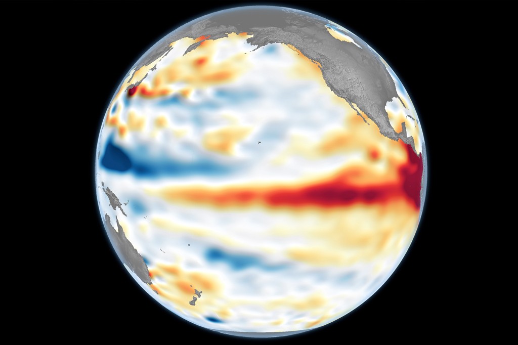 Globo terrestre mostrando o Oceano Pacífico com áreas em vermelho indicando águas mais quentes e em azul, águas mais frias, representando o fenômeno El Niño